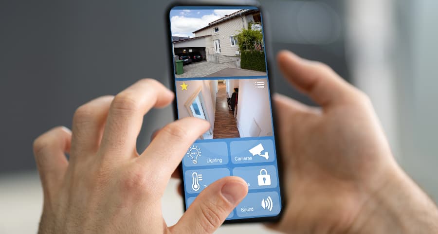 Person looking at video camera feeds on a cell phone